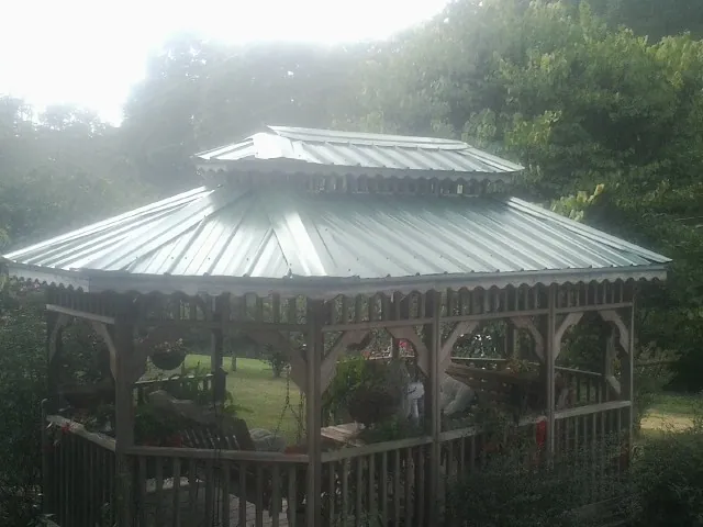 Two tier green metal roof on a garden gazebo in Malibu